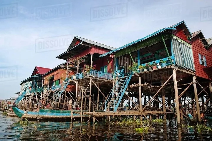 Colourful traditional stilted houses standing above the water